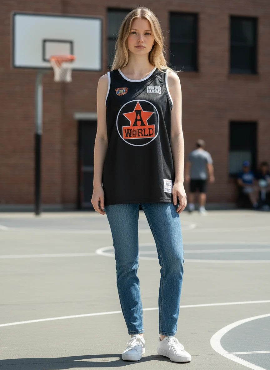 Throwback Rack black Astro World basketball jersey with orange star graphic and white trim. Mesh fabric.