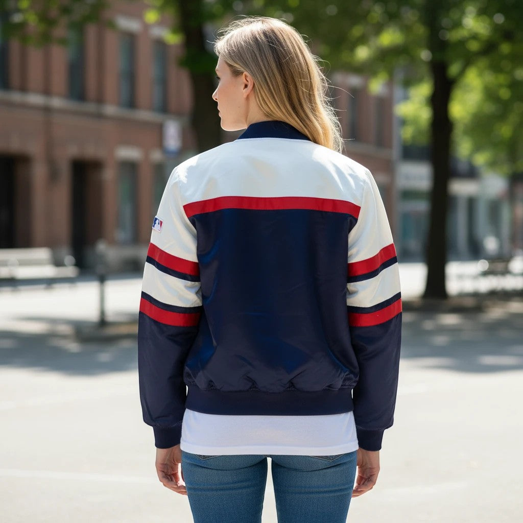 Throwback Rack Mitchell & Ness Boston heavyweight bomber jacket with navy, white, and red stripes worn by a woman.