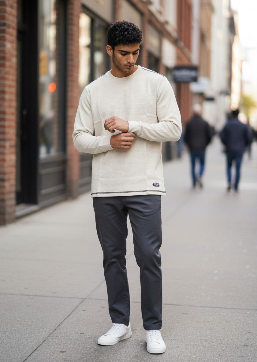 Throwback Rack cream waffle-knit thermal long sleeve shirt with contrast stitching and Kangol logo tag.