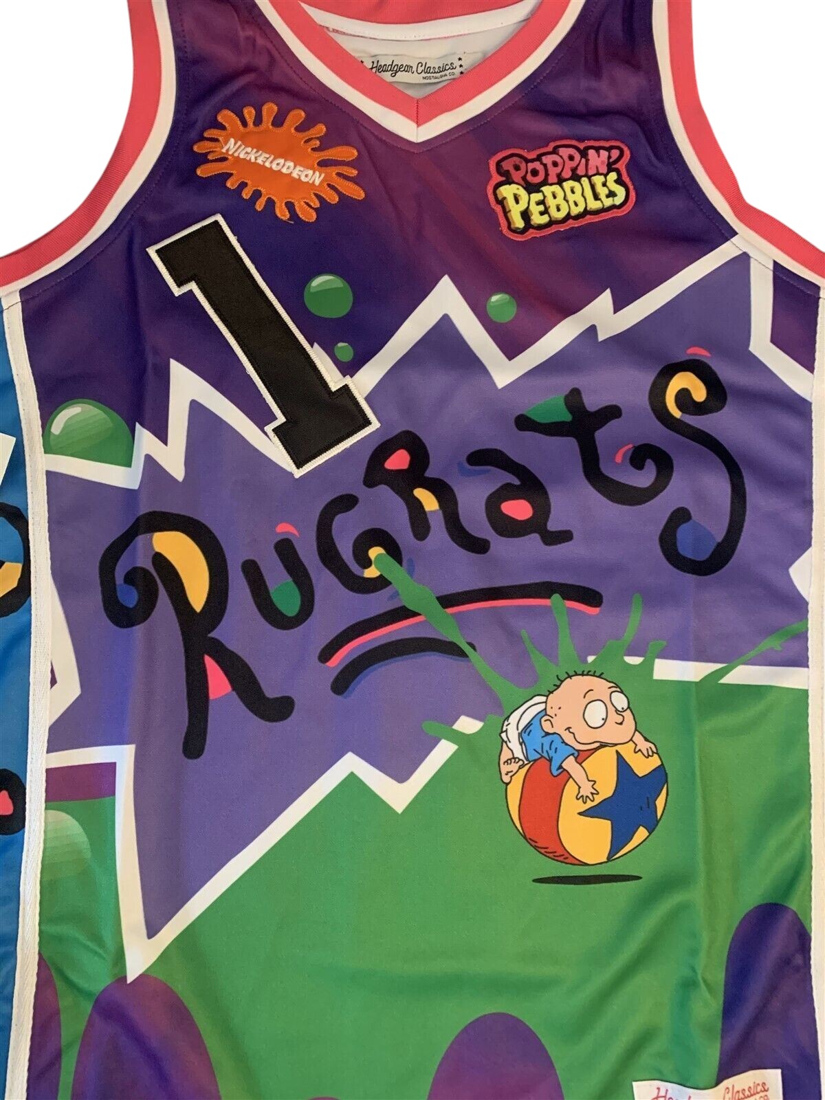 Throwback Rack Rugrats Reptar Cereal basketball jersey in purple and green with Tommy Pickles graphic and number 1