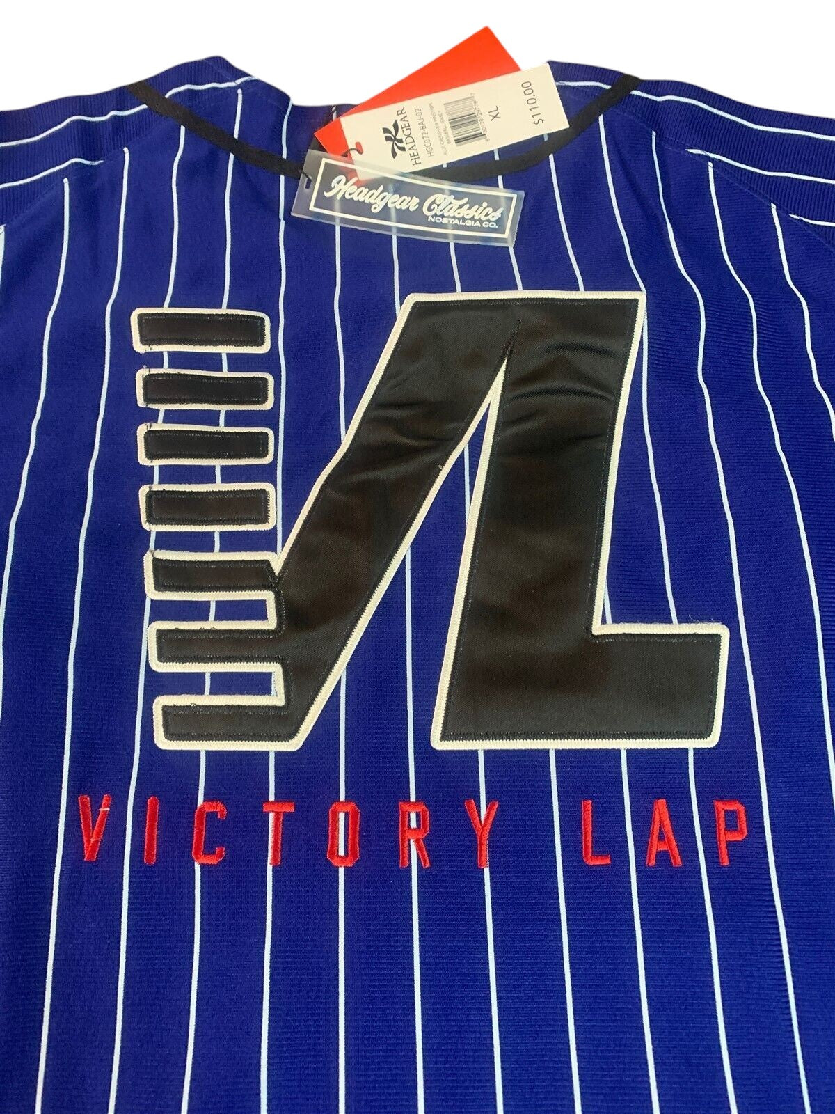 Throwback Rack royal blue pinstripe baseball jersey with black and white Victory Lap embroidery on the chest