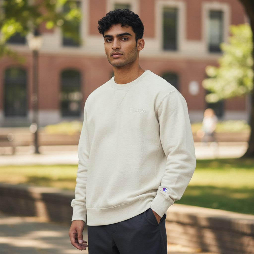 Throwback Rack cream heavyweight cotton Champion Reverse Weave crewneck sweatshirt with embroidered logo on chest and cuff.