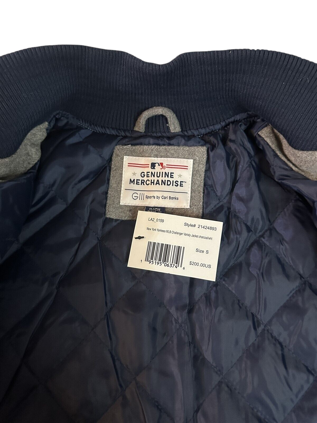 Throwback Rack New York Yankees varsity jacket interior label and quilted navy blue lining with original price tag