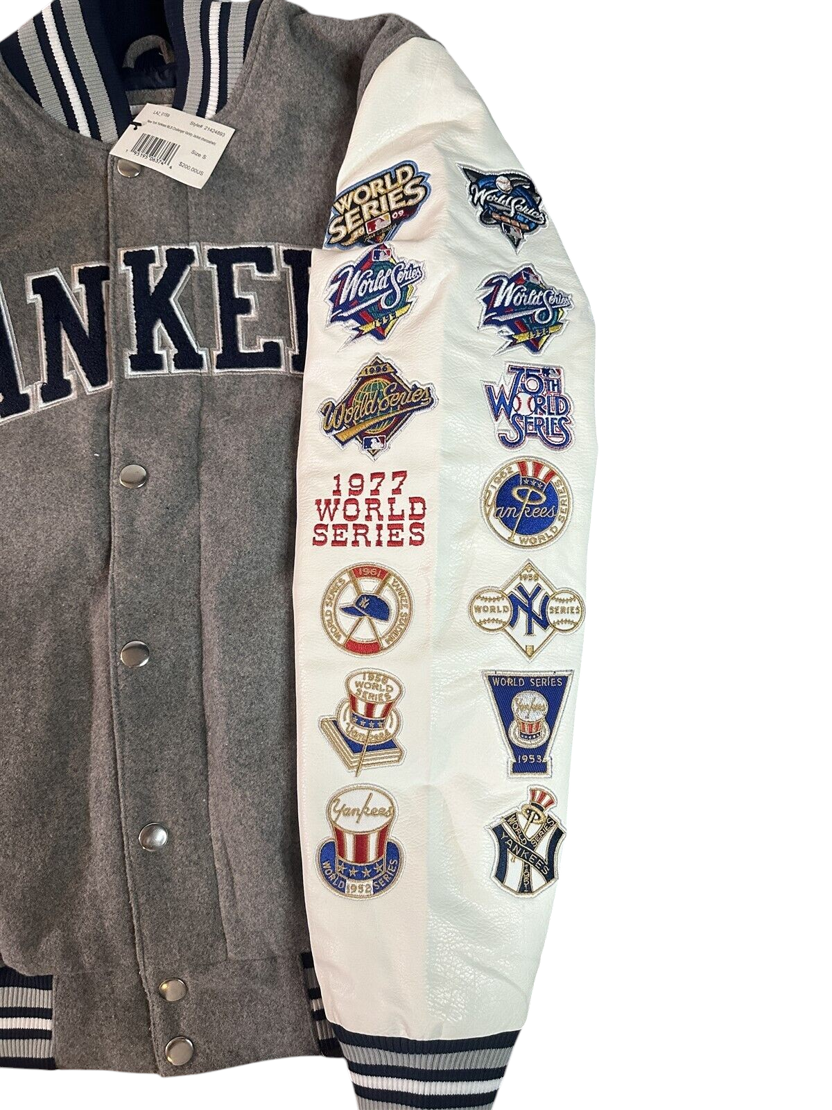 Throwback Rack New York Yankees varsity jacket with grey twill body, white faux leather sleeves, and championship patches