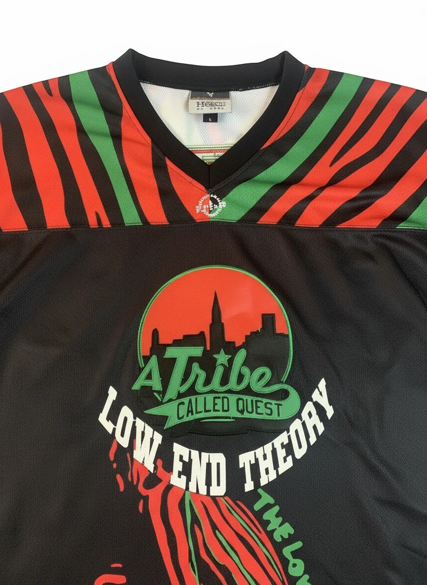 Throwback Rack A Tribe Called Quest Low End Theory black hockey jersey with red and green stripes, album logo, and "QUEST 4" on back.