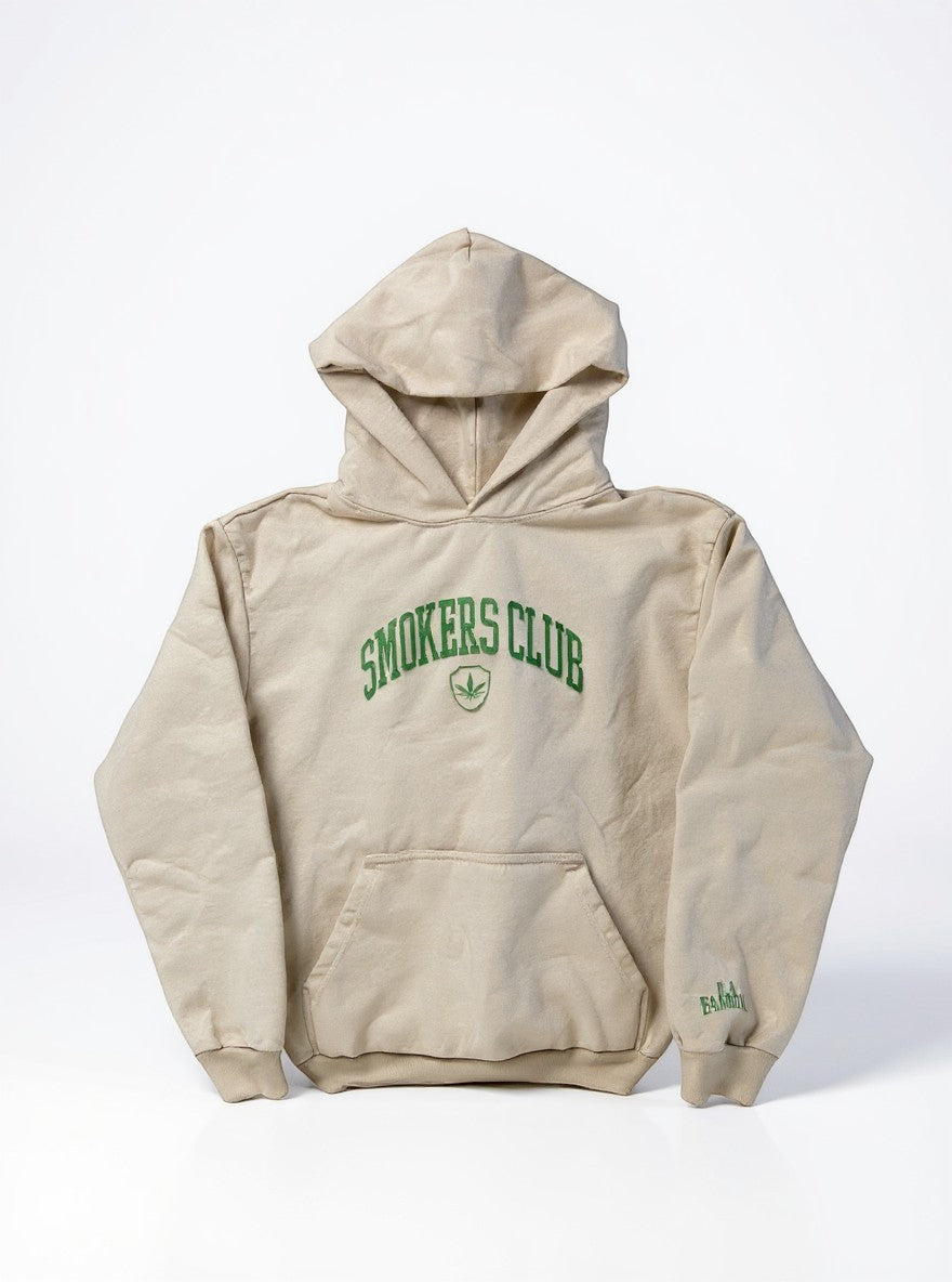 Throwback Rack beige cotton hoodie with green embroidered 'Smokers Club' text and leaf logo on the chest.