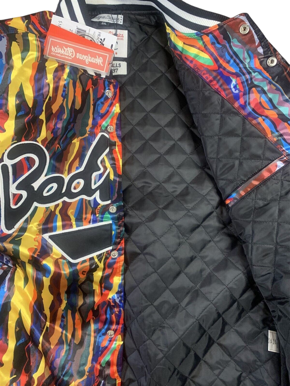 Throwback Rack Biggie Smalls Bad Boy varsity jacket with vibrant abstract print and black quilted interior lining