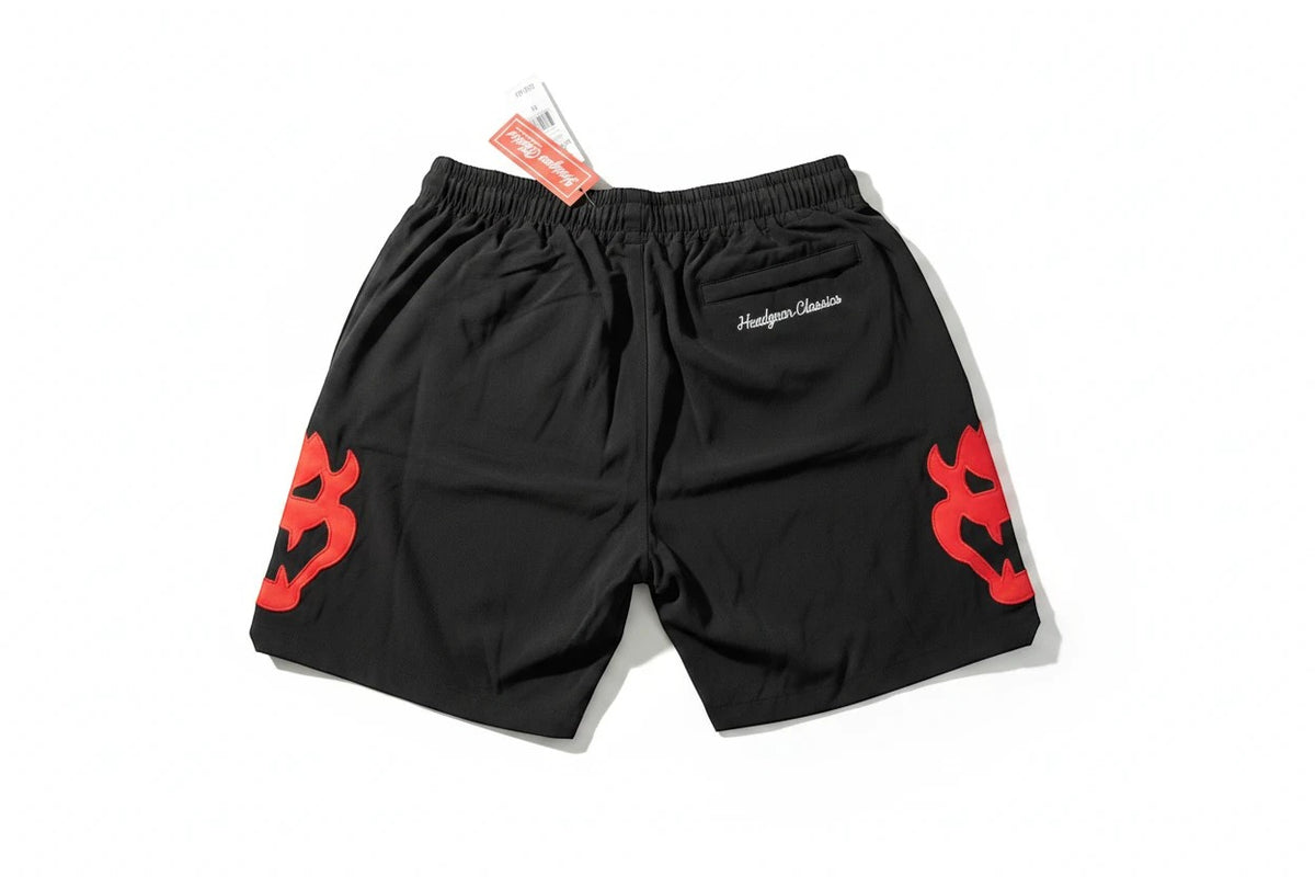 Throwback Rack black basketball shorts by Headgear Classics featuring red Bowser character graphics and zippered pockets