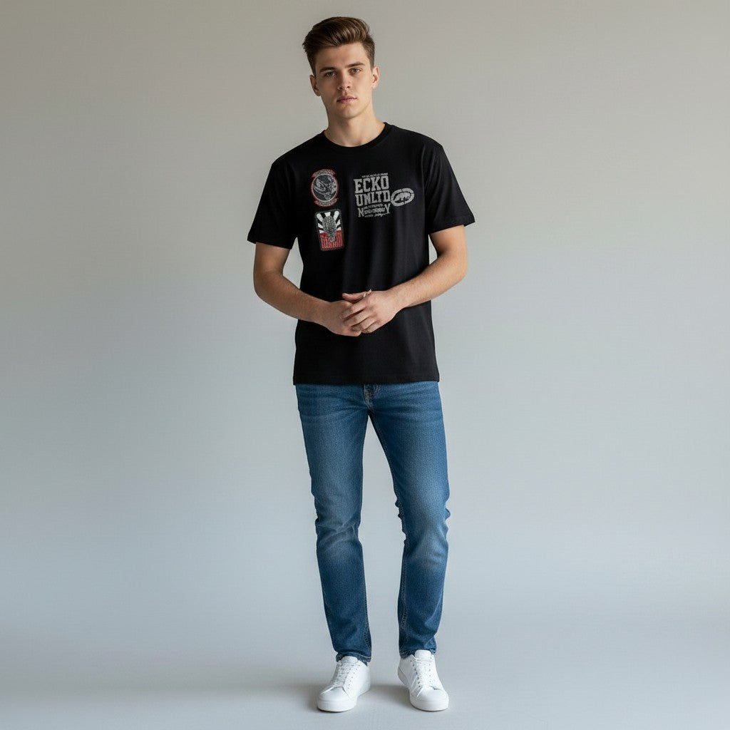 Throwback Rack black cotton t-shirt with Ecko UNTLD rhino and graphic patches on the chest. Model wears size M.