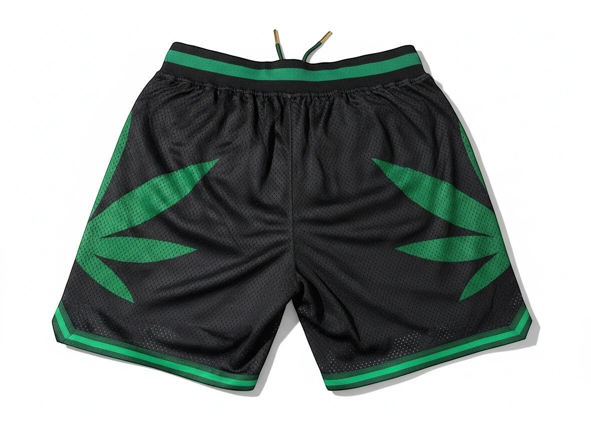 Throwback Rack black mesh basketball shorts with green leaf design and striped waistband. Elastic waist with drawstring.