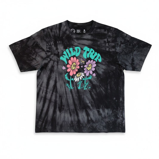 Throwback Rack black tie-dye t-shirt with a graphic of "Wild Trip" text above smiling flowers and a butterfly. Made of cotton.
