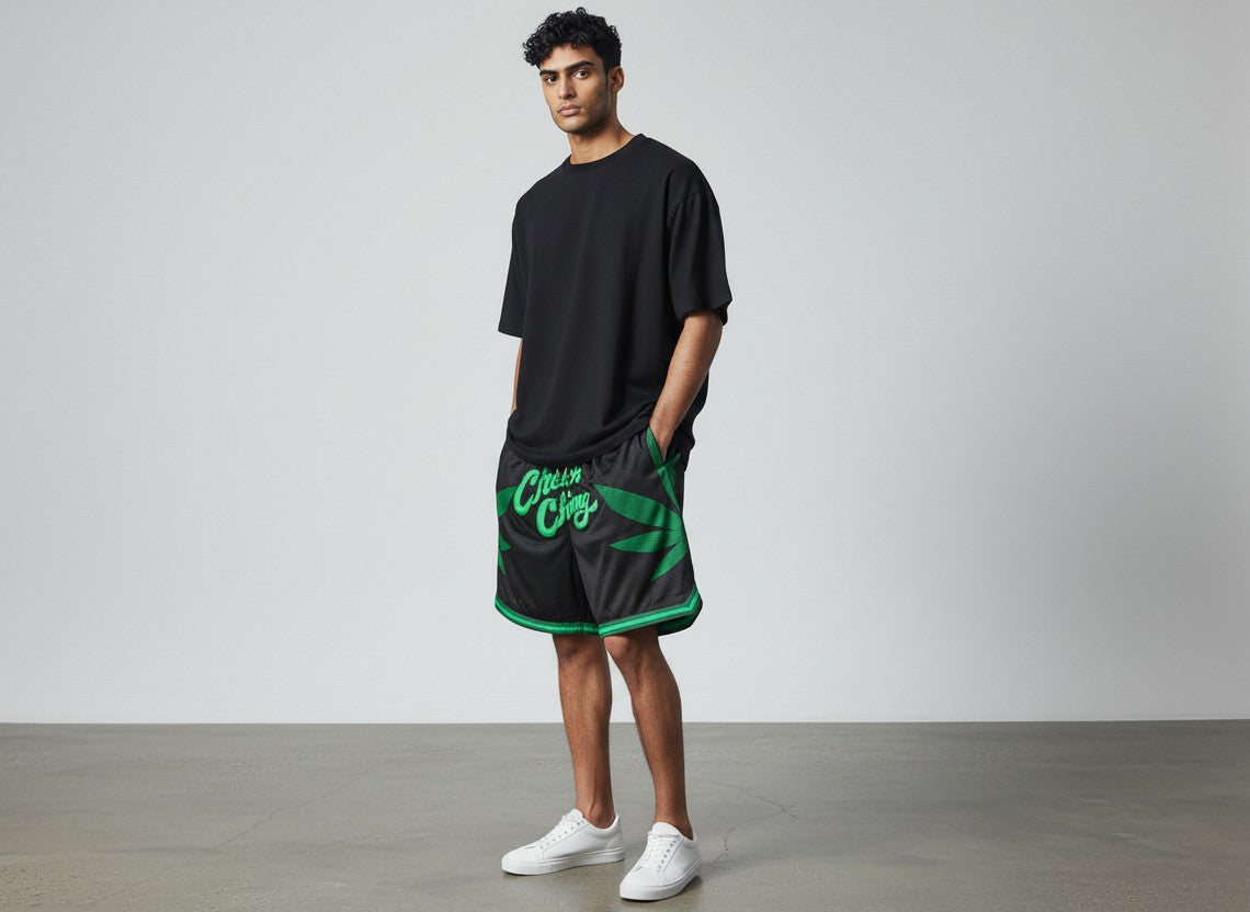 Throwback Rack Cheech and Chong basketball shorts in black mesh with green leaf graphic and embroidered logo