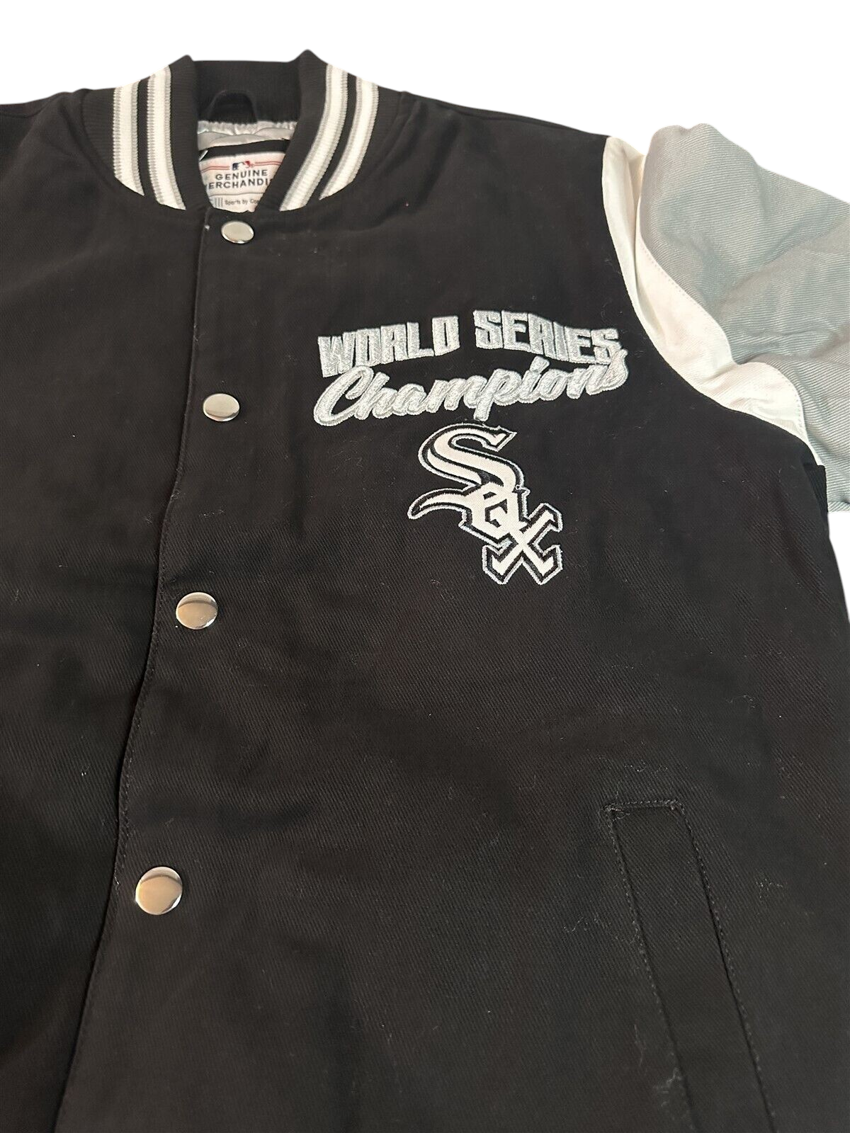 Throwback Rack Chicago White Sox World Series Champions varsity jacket with black body, grey sleeves, and embroidery.