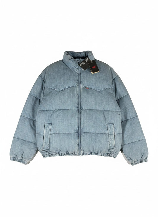 Throwback Rack light wash denim puffer jacket with western yoke detail and red Levi's logo.