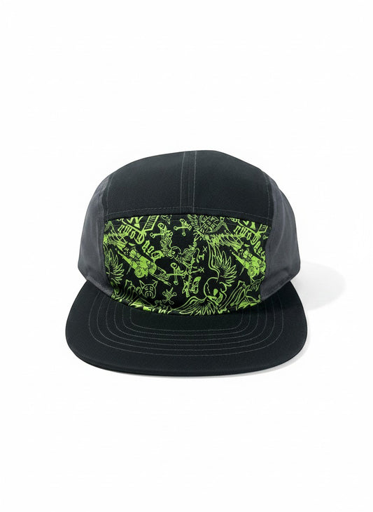 Throwback Rack Dog Town skater hat in black with a neon green graphic print featuring skulls, wings, and skateboards. Adjustable strap.