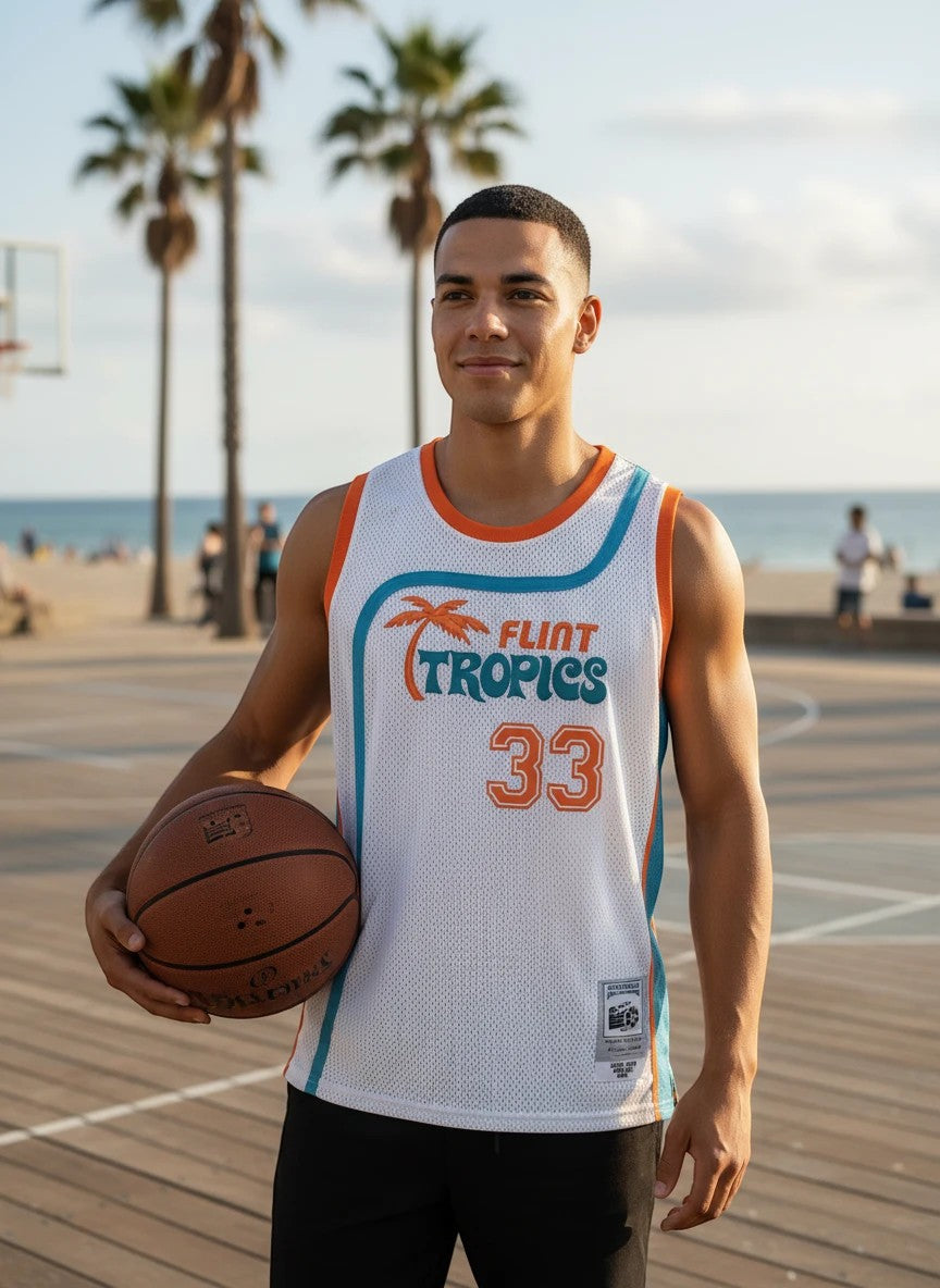 Throwback Rack white mesh basketball jersey with teal and orange trim, featuring Flint Tropics logo and number 33.