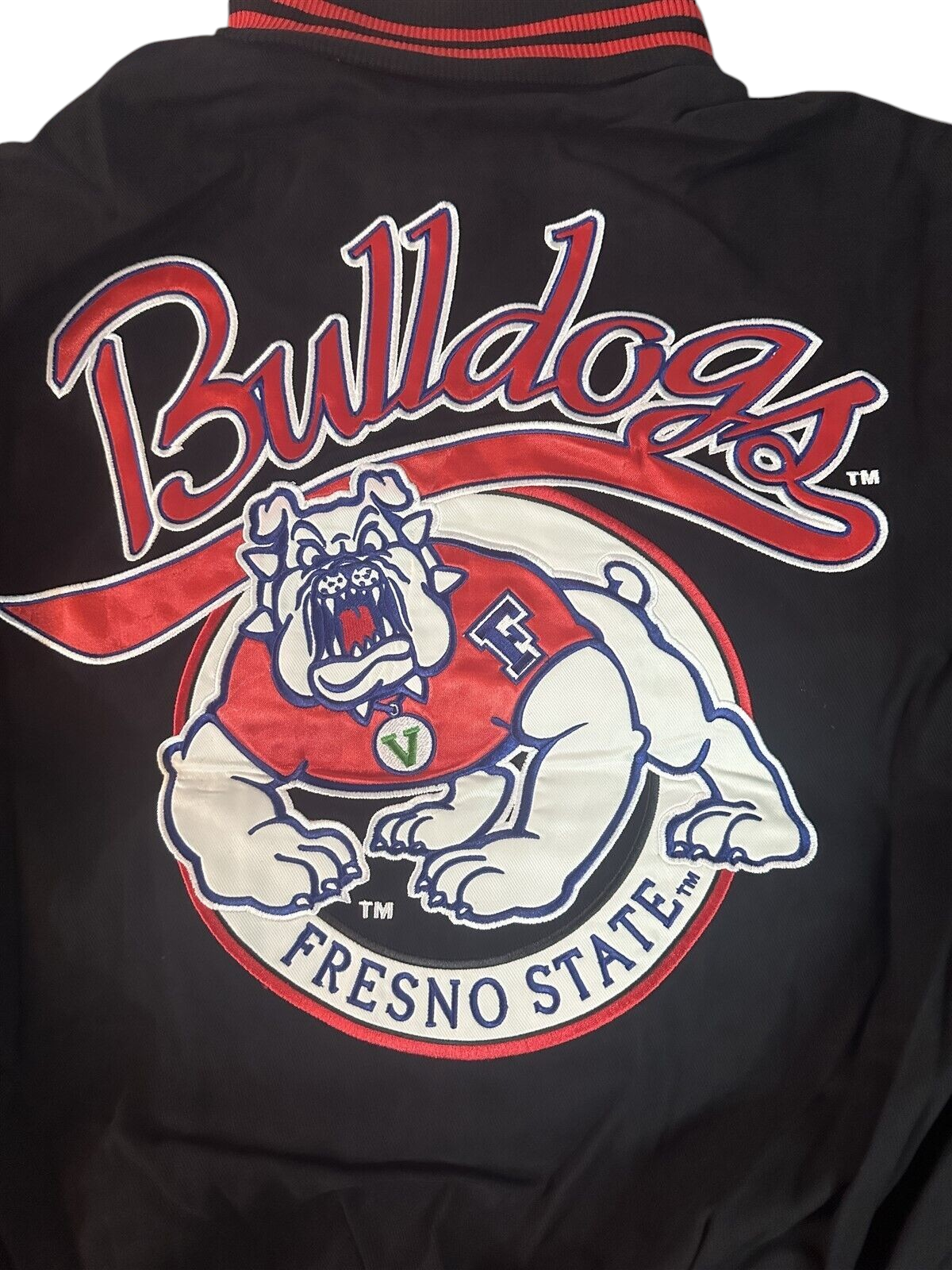 Throwback Rack Fresno State Bulldogs varsity jacket featuring a large embroidered mascot graphic on the back
