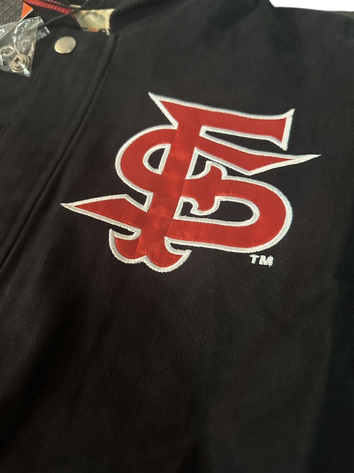 Throwback Rack Fresno State Bulldogs varsity jacket featuring red and white FS logo embroidery on black fabric