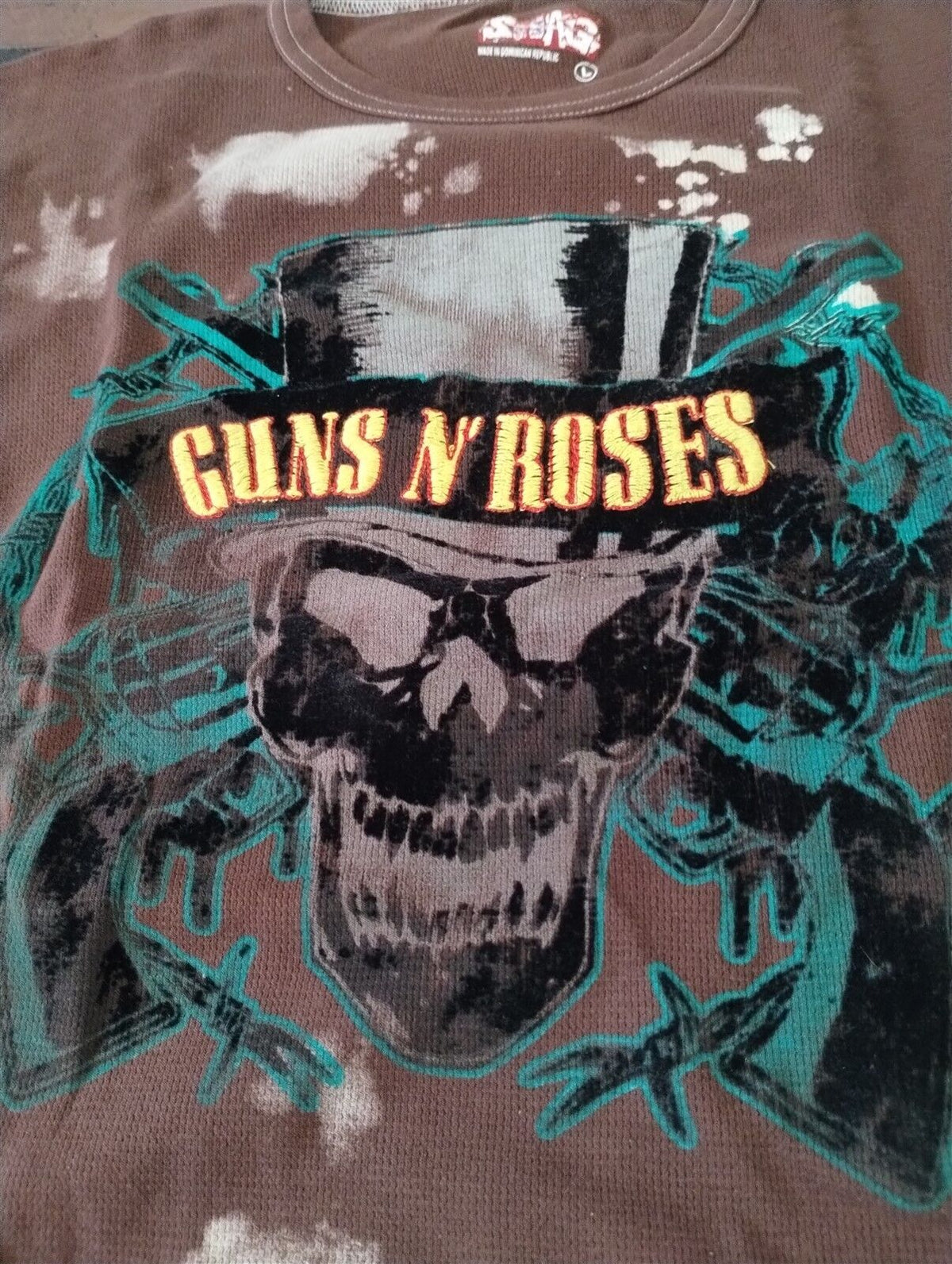 Throwback Rack brown thermal long sleeve shirt featuring a Guns N' Roses skull graphic with teal and yellow accents.