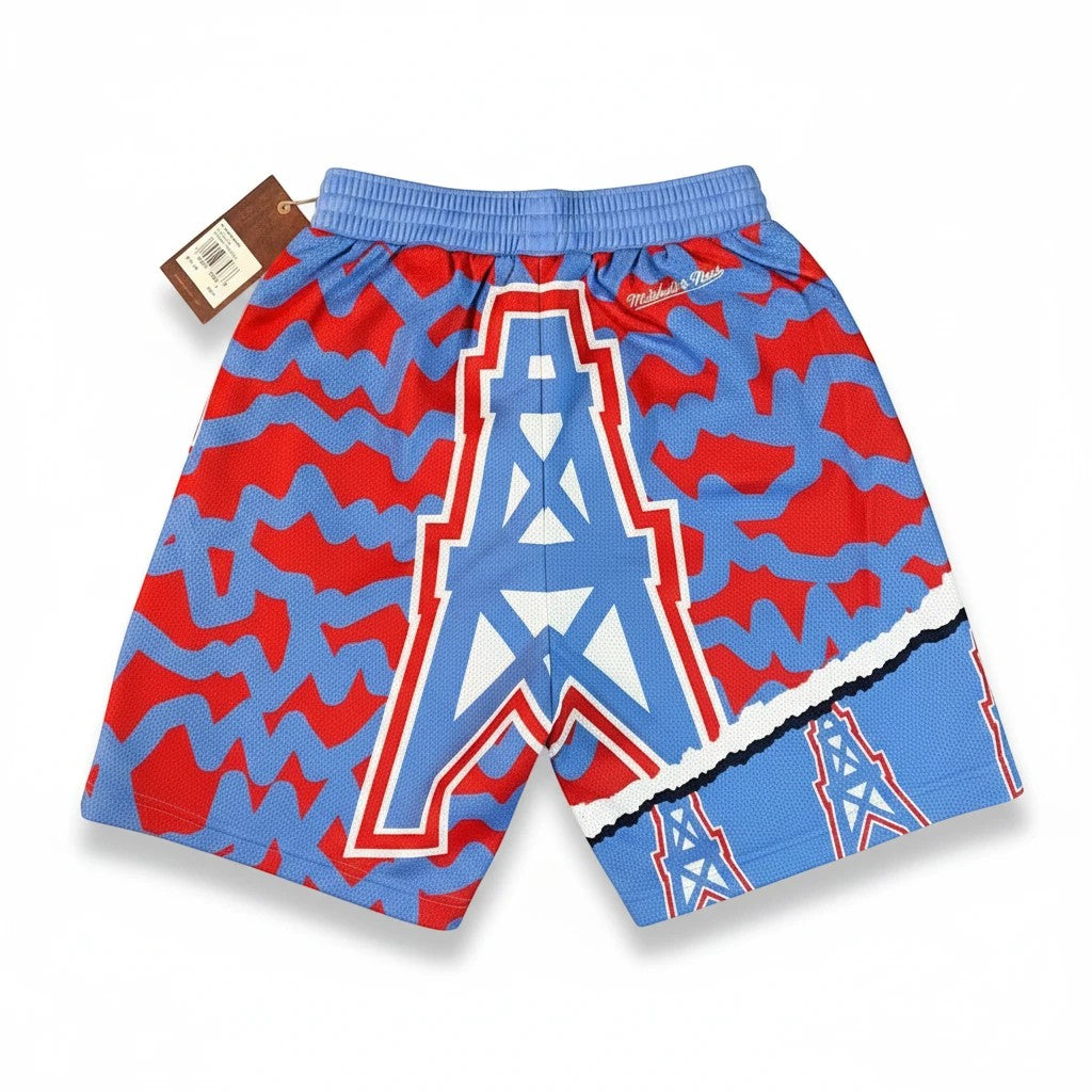Throwback Rack Houston Oilers blue and red all-over print basketball shorts with large "A" logo and "OILERS" lettering.