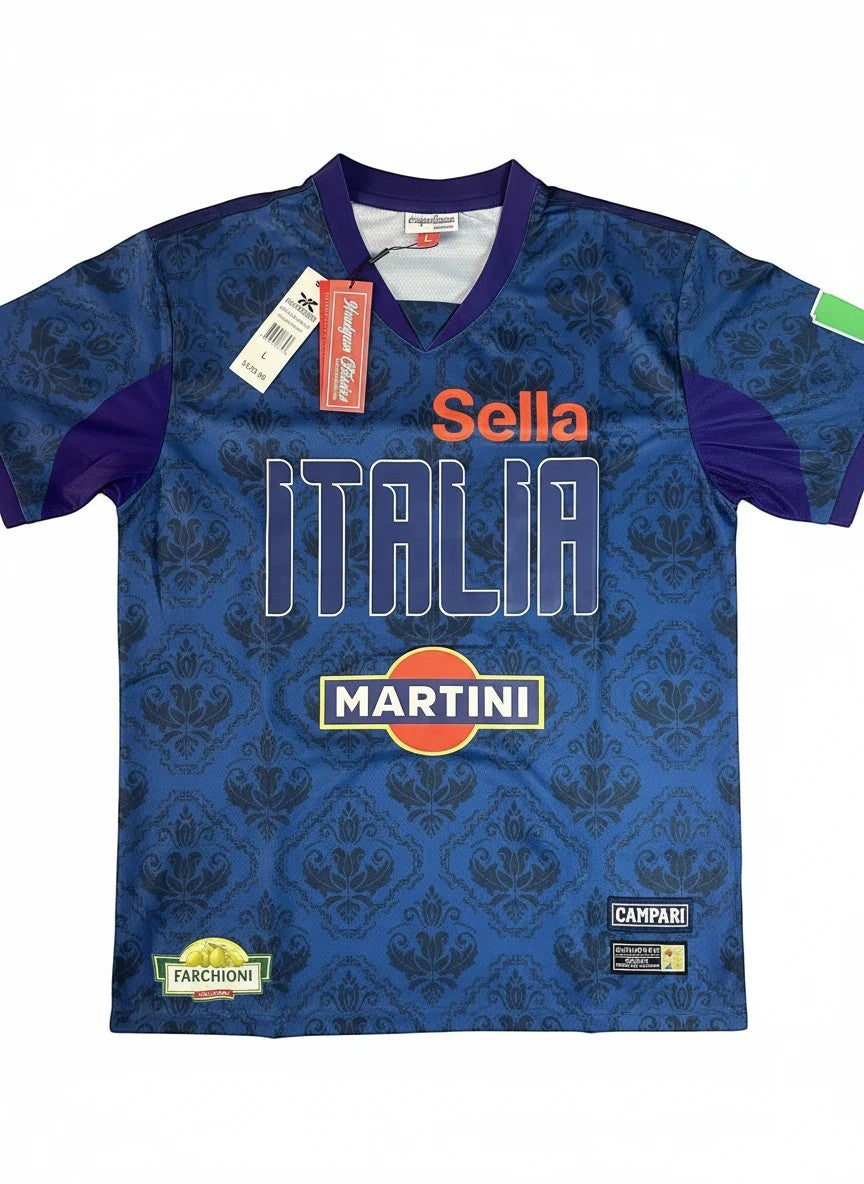 Throwback Rack Italia Martini Soccer Jersey, deep blue with damask pattern, white ITALIA text, orange Martini logo, short sleeves, V-neck.