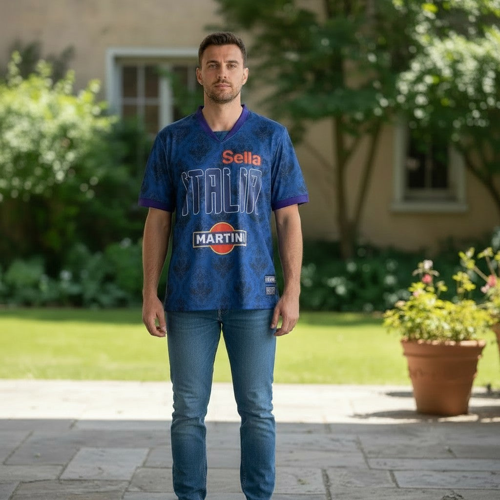 Throwback Rack Italia Martini Soccer Jersey, deep blue with damask pattern, white ITALIA text, orange/yellow Martini logo, short sleeves, V-neck.