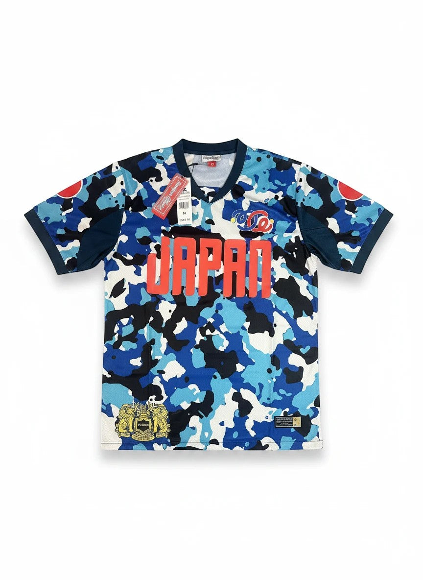 Throwback Rack blue, black, and white camouflage soccer jersey with "JAPAN" graphic and red sun emblems.