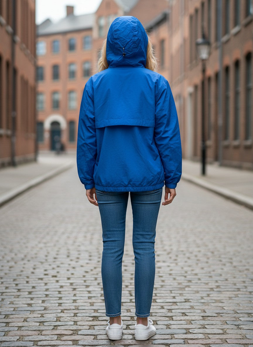 Throwback Rack Levi's Gold Tab Bolinas Anorak Jacket in bright blue, featuring a hood and elastic cuffs, worn by a woman.
