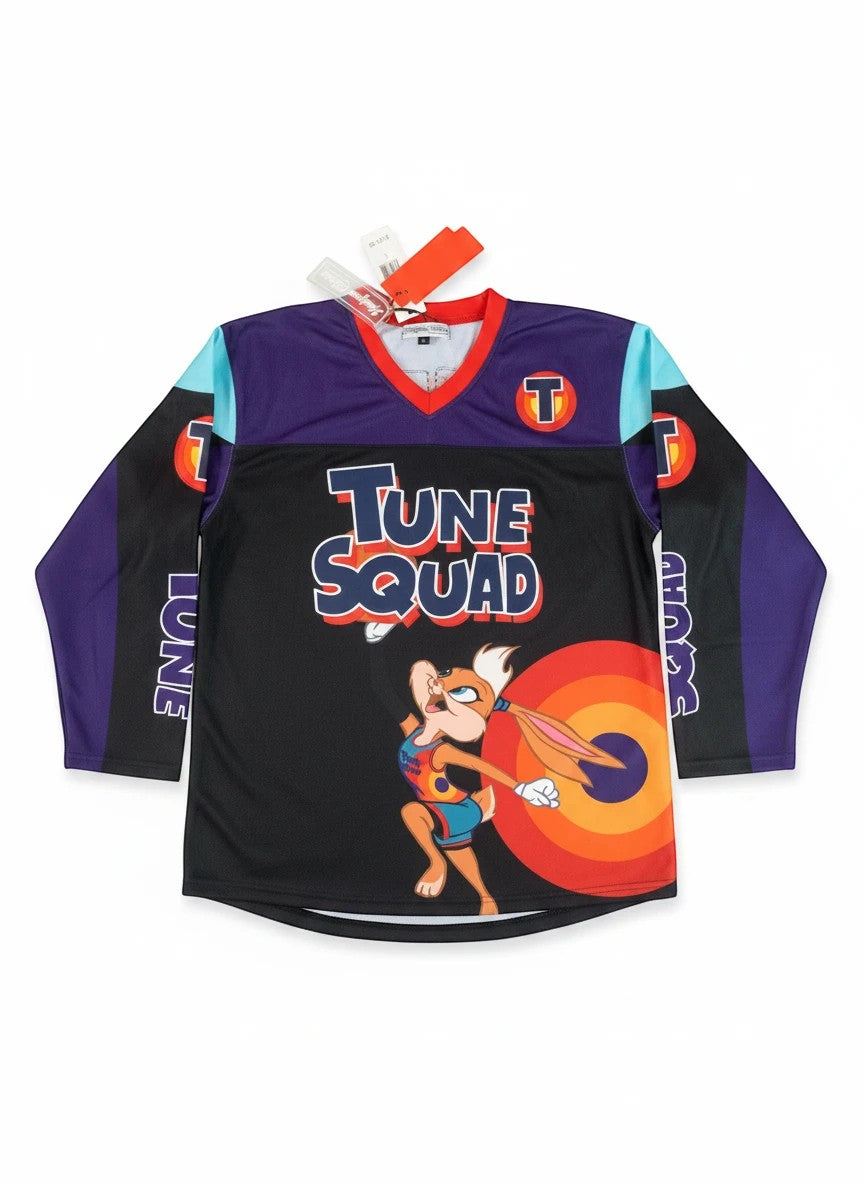 Throwback Rack Tune Squad Lola Bunny basketball jersey with purple, black, and aqua color blocking. Features Lola Bunny graphic and "TUNE SQUAD" text.