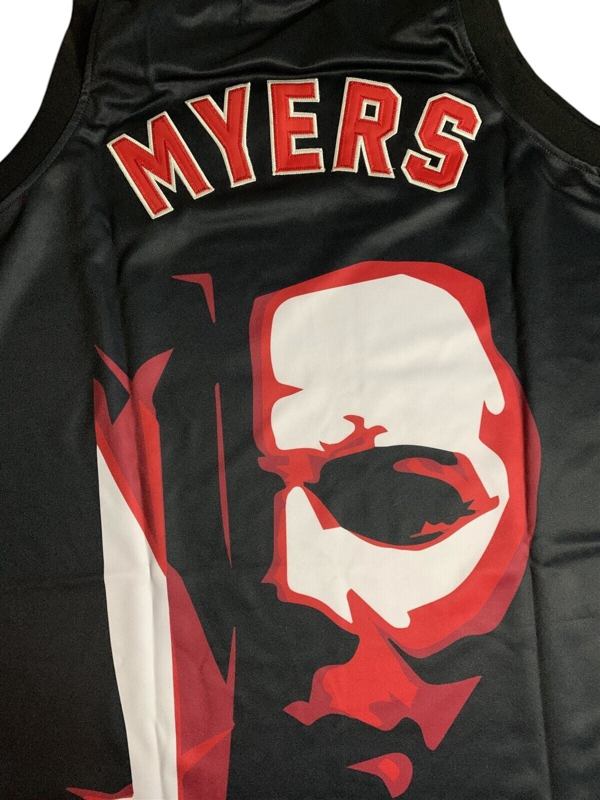 Throwback Rack Michael Myers basketball jersey in black with red and white graphic portrait and lettering on mesh fabric