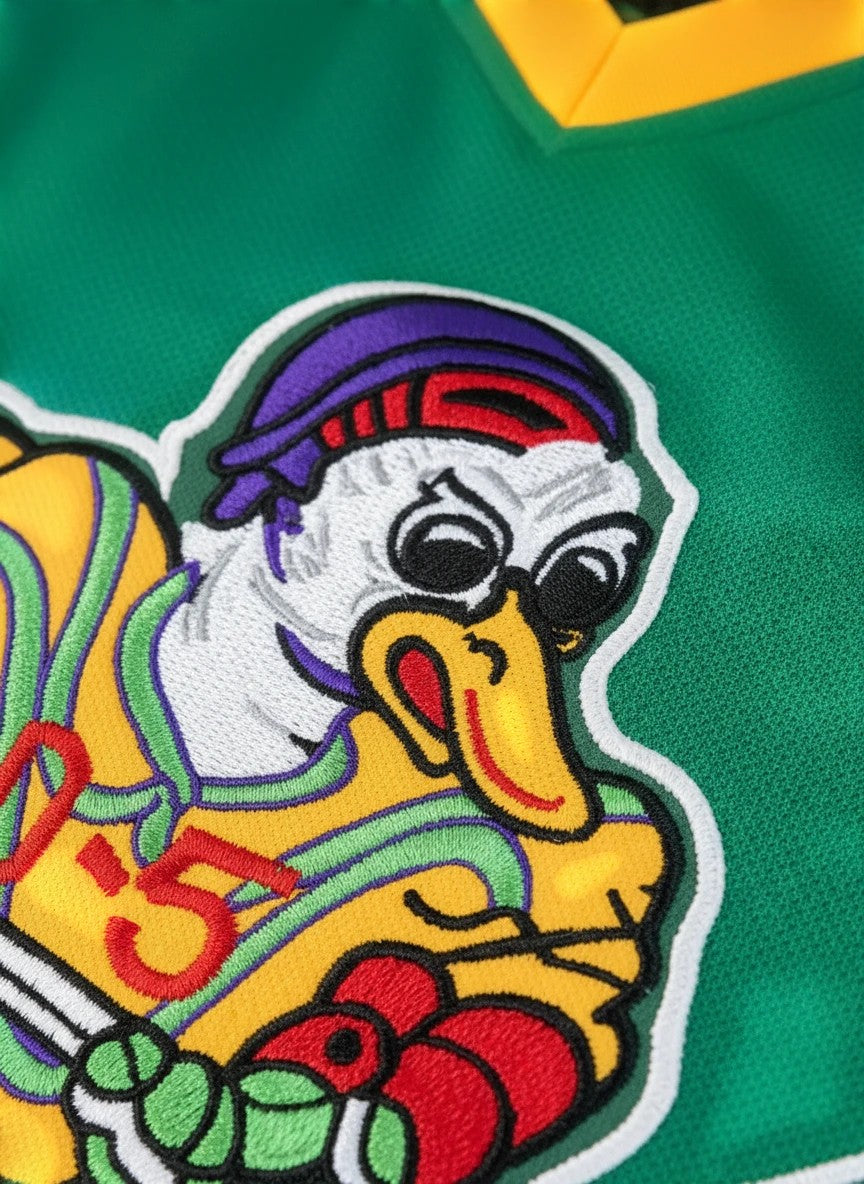 Throwback Rack green hockey jersey with embroidered Mighty Ducks mascot and Goldberg 33 on back