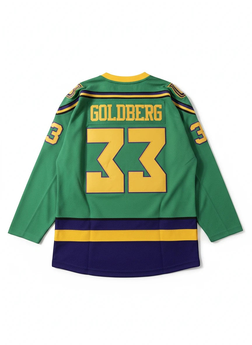 Throwback Rack green hockey jersey with "GOLDBERG 33" on the back and "33" on the sleeve. Features purple and gold stripes.