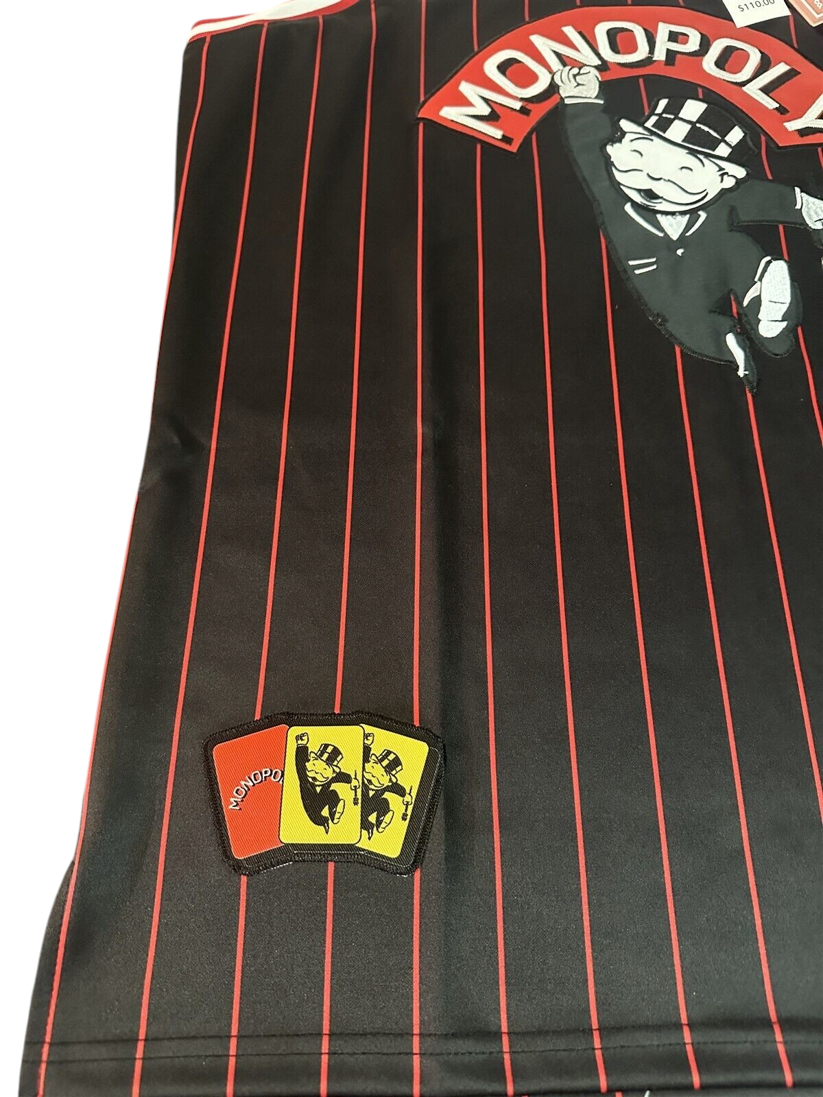 Throwback Rack Monopoly basketball jersey in black with red pinstripes, featuring Rich Uncle Pennybags and patches.