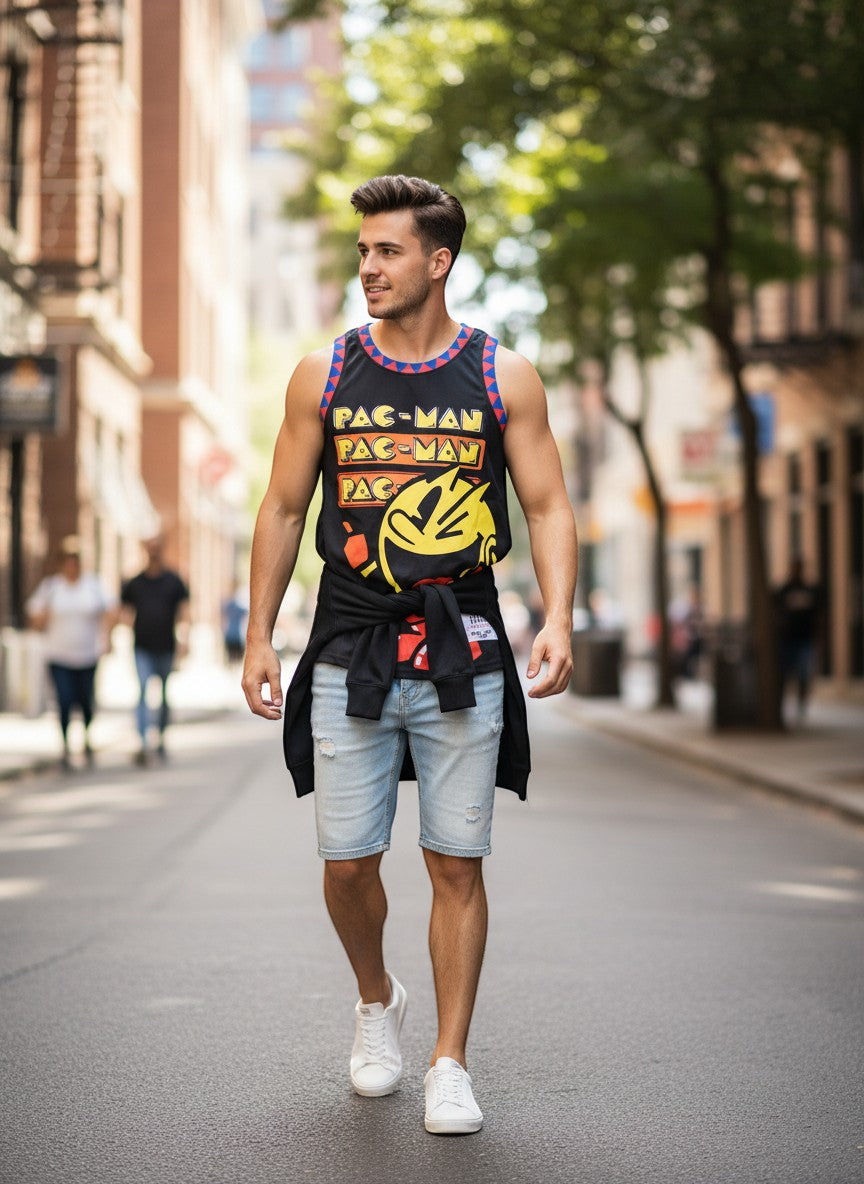 Throwback Rack black Pac-Man basketball jersey with blue and red trim, paired with light wash distressed denim shorts.