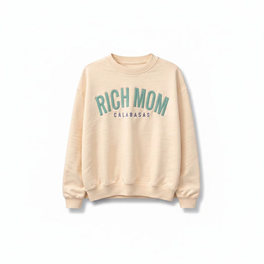 Throwback Rack peach crewneck sweatshirt with "RICH MOM CALABASAS" text in teal.