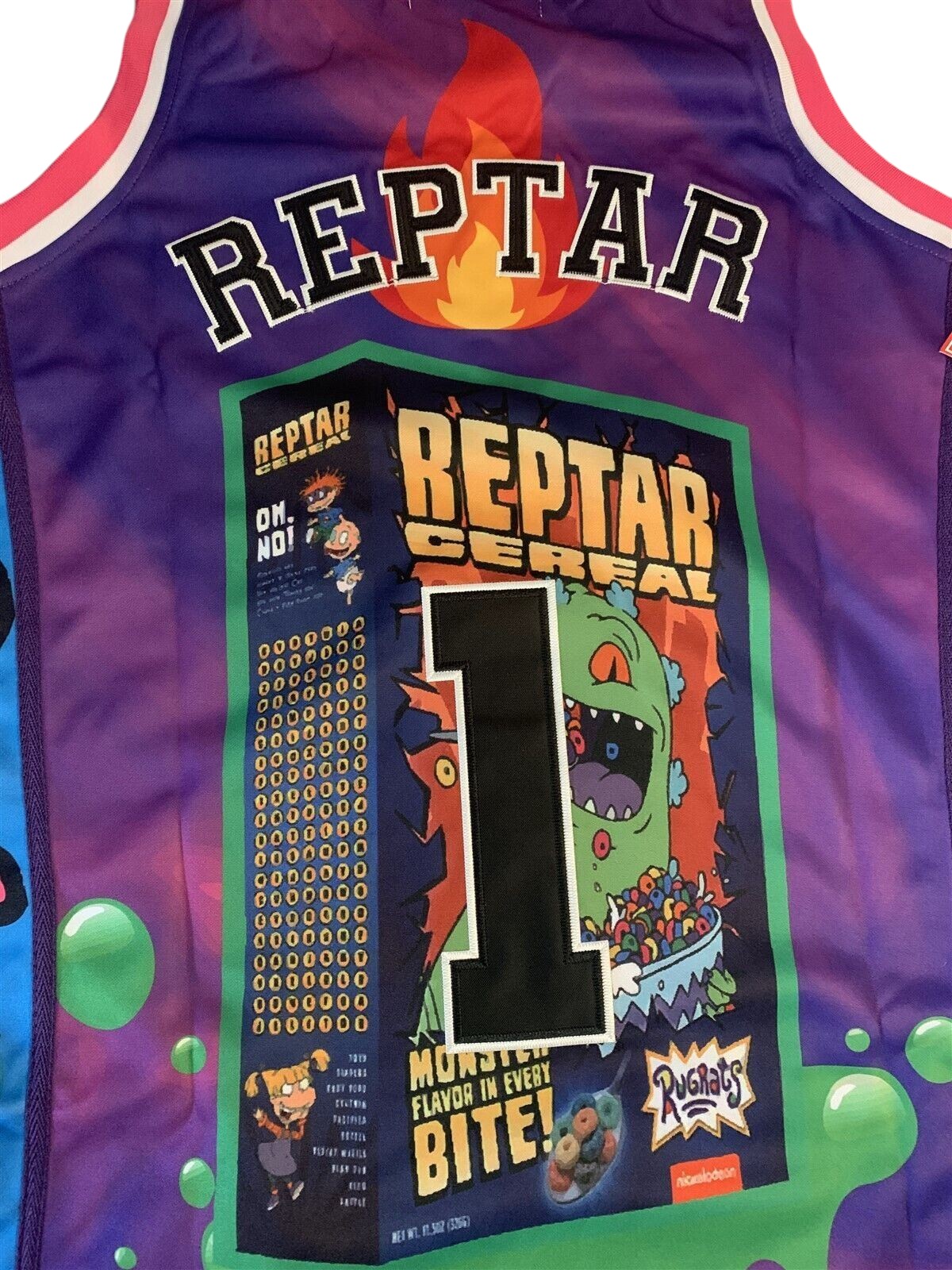 Throwback Rack Rugrats Reptar Cereal basketball jersey in purple with green and blue graphics and stitched number one
