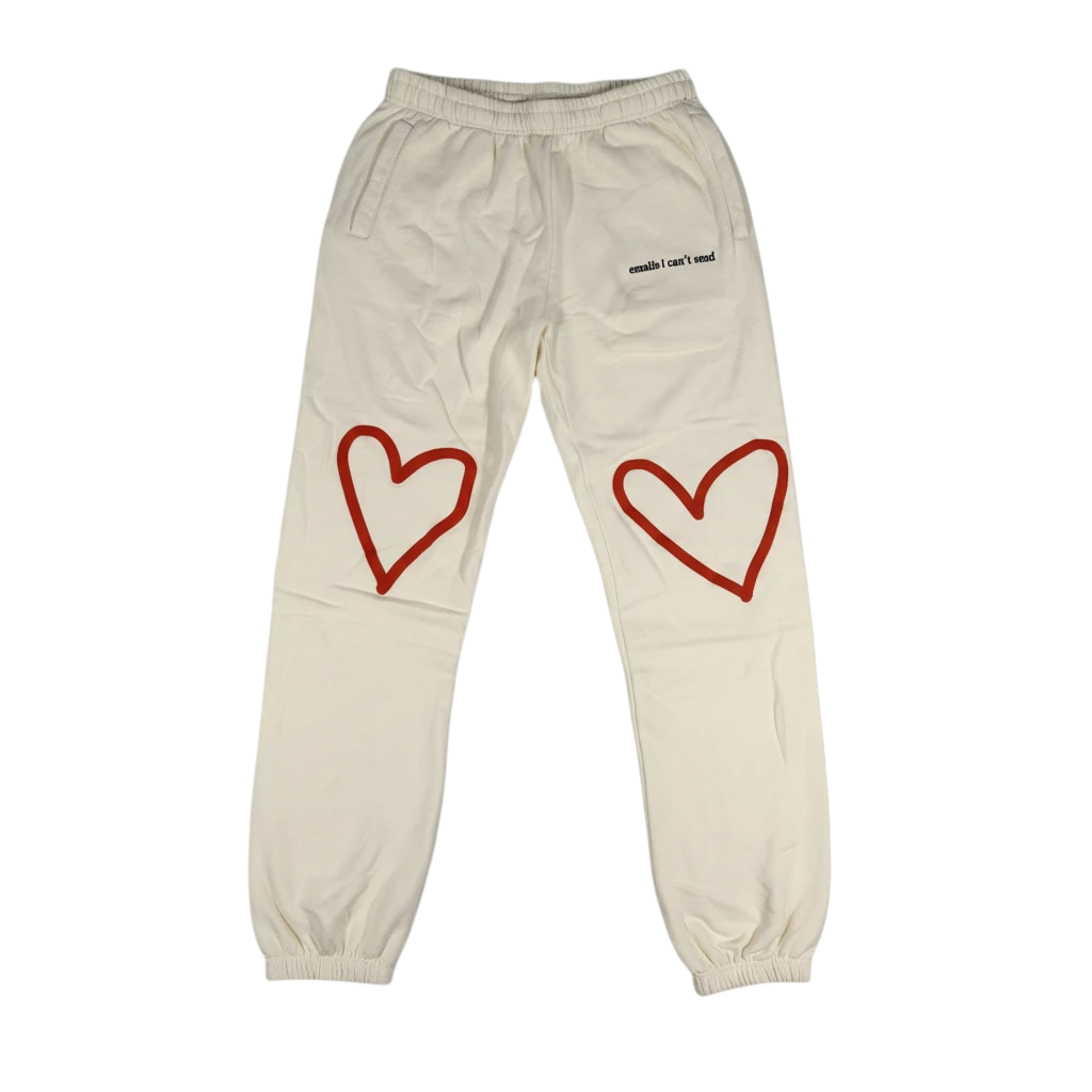 Throwback Rack cream sweatpants featuring red heart graphics on the knees and Sabrina Carpenter branding.