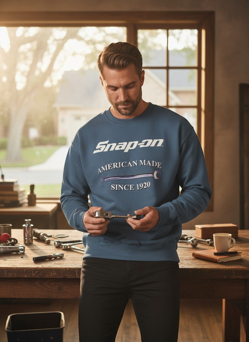 Throwback Rack blue crewneck sweatshirt with Snap-On Wrench American Made Since 1920 graphic. Model is holding a wrench.
