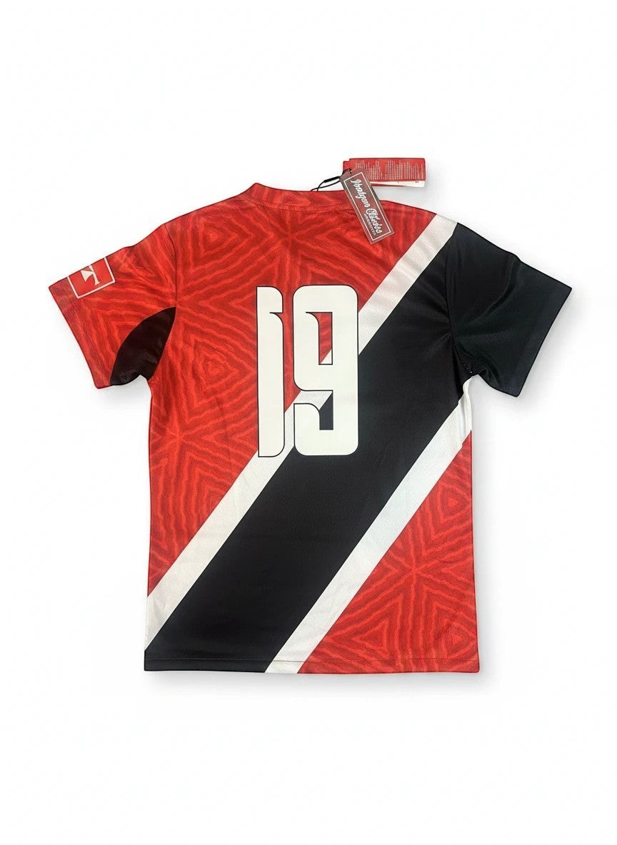 Throwback Rack Trinidad 1990 World Cup Soccer Jersey, red with black and white diagonal stripes, geometric pattern, number 19 on back.