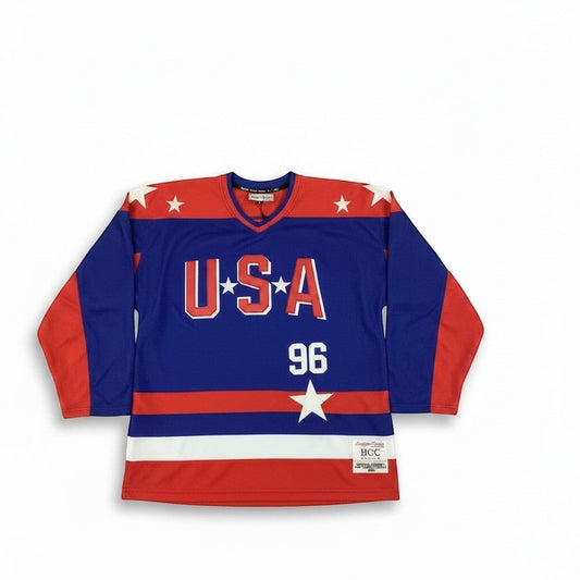 Throwback Rack blue USA hockey jersey with red sleeves, stars, and "96" Conway design. Features "USA" on chest.