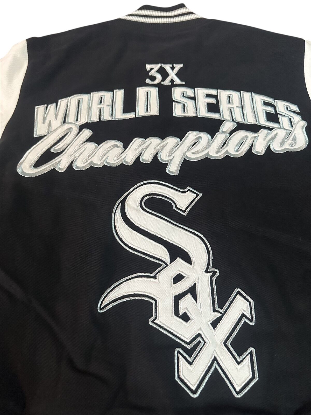 Throwback Rack Chicago White Sox varsity jacket back view featuring 3X World Series Champions embroidery and team logo