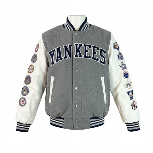 Throwback Rack New York Yankees G-III varsity jacket with grey twill body, white faux leather sleeves, and championship patches