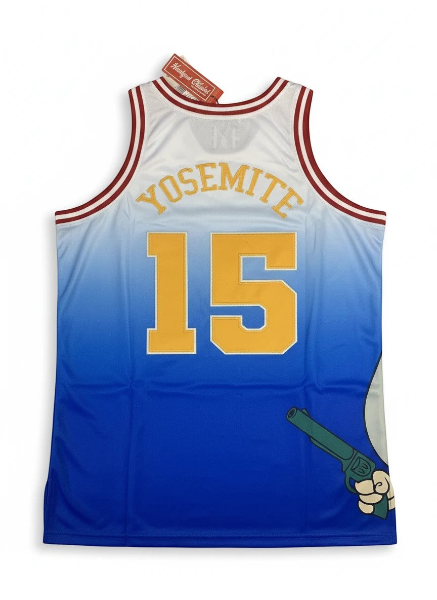Throwback Rack Yosemite Sam basketball jersey with white-to-blue gradient, number 15, and yellow lettering on back.