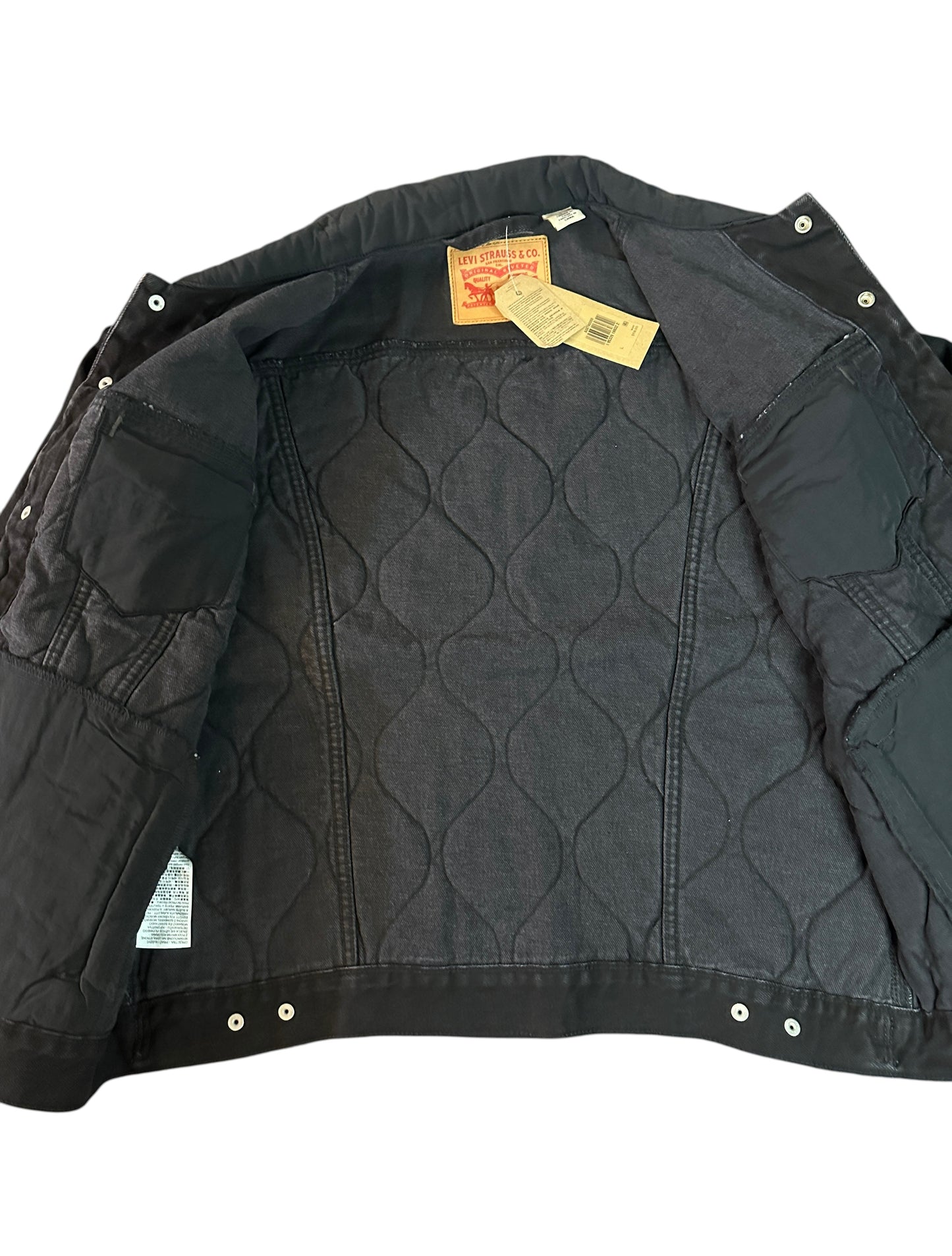 Throwback Rack Levi's black denim jacket with quilted lining and brass buttons. Classic trucker style with tags attached.