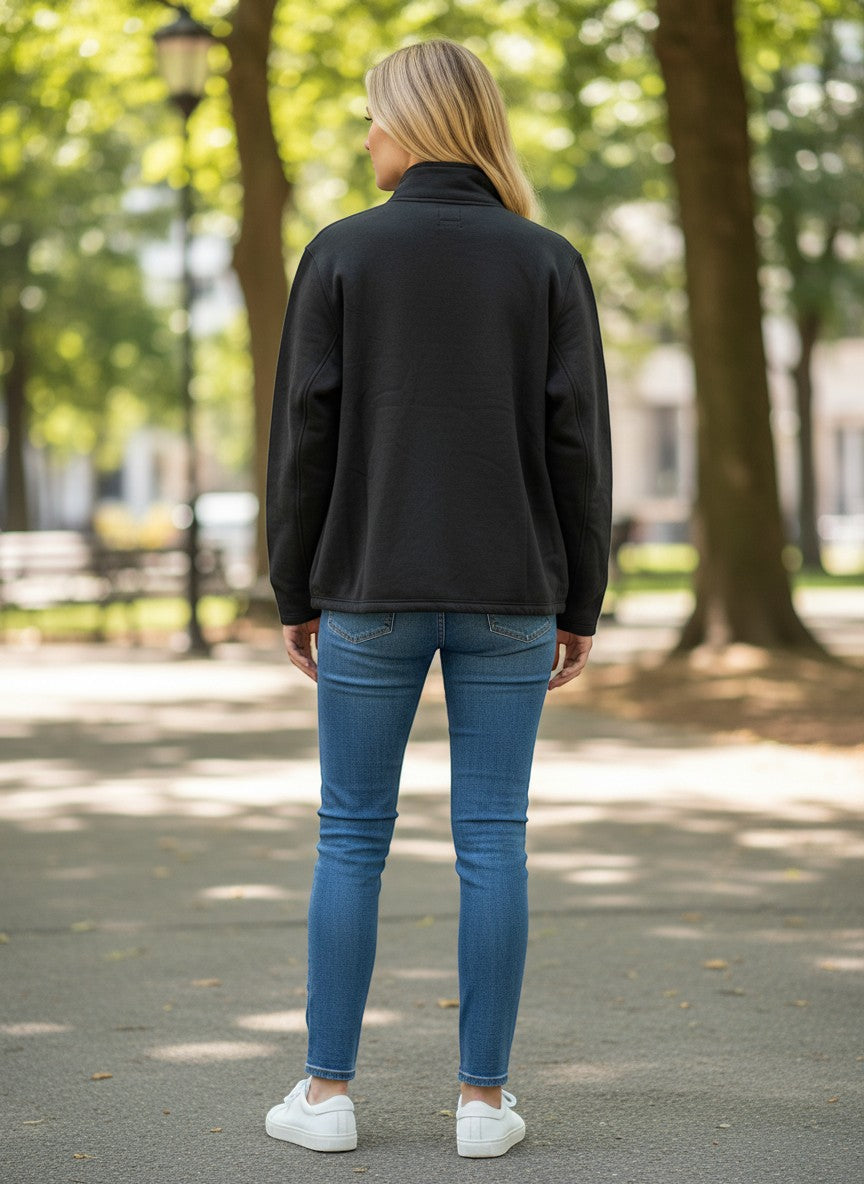 Throwback Rack black Levi's 1/4 zip mock neck sweatshirt made of fleece, worn by a woman with blonde hair in blue jeans.