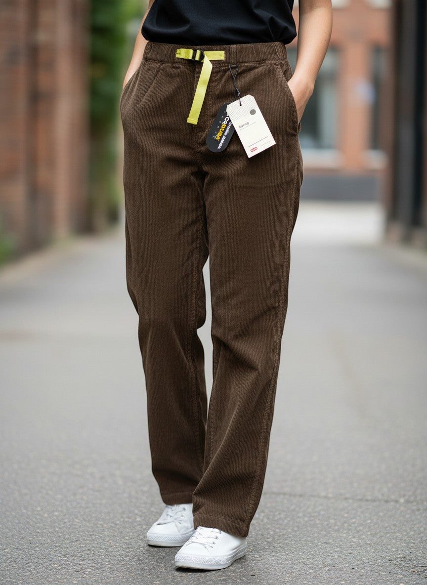 Throwback Rack Levi's brown corduroy pants with yellow belt detail and white sneakers.
