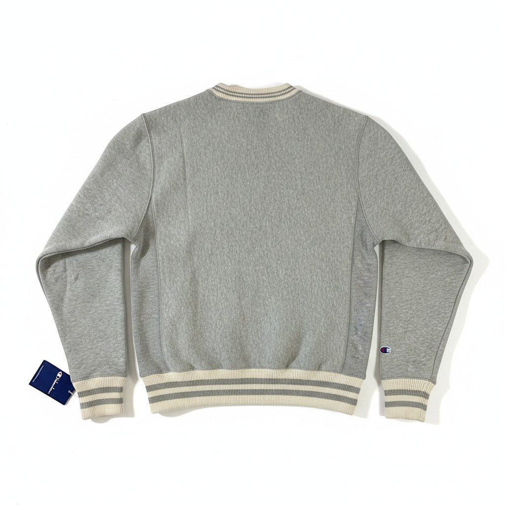 Throwback Rack Champion Oxford Gray Reverse Weave Crew Neck Sweatshirt with embroidered logo on sleeve and striped cuffs.