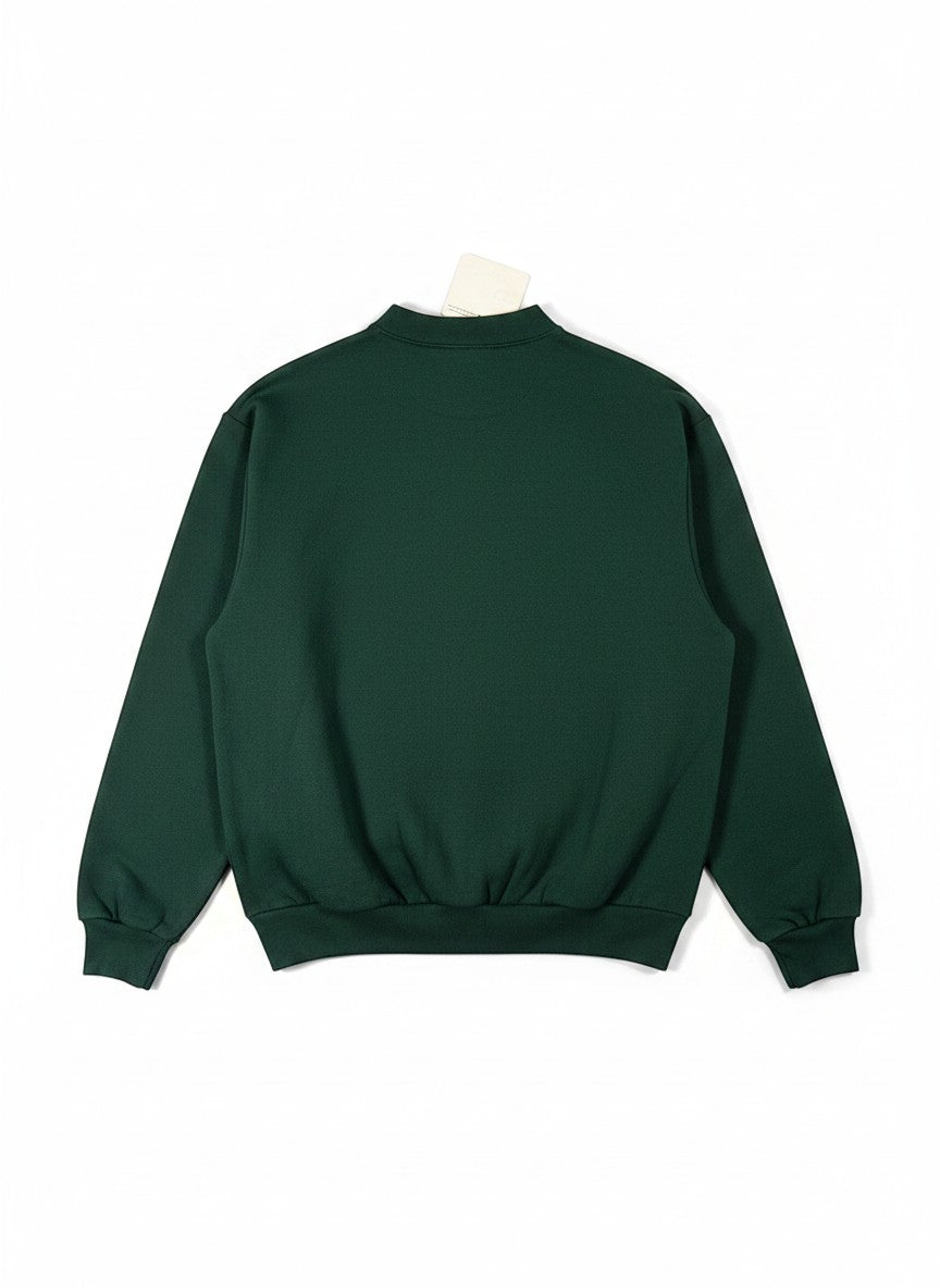 Throwback Rack dark green vintage Tweedy-Bird Christmas sweatshirt with a relaxed fit and crew neck.