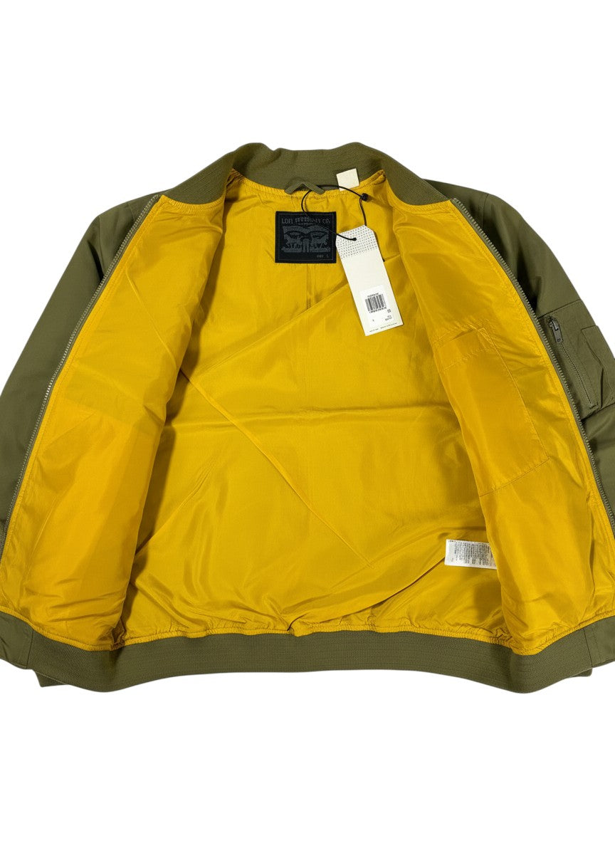 Throwback Rack olive green Levi's Bayview Bomber Jacket with bright yellow lining and tags attached.