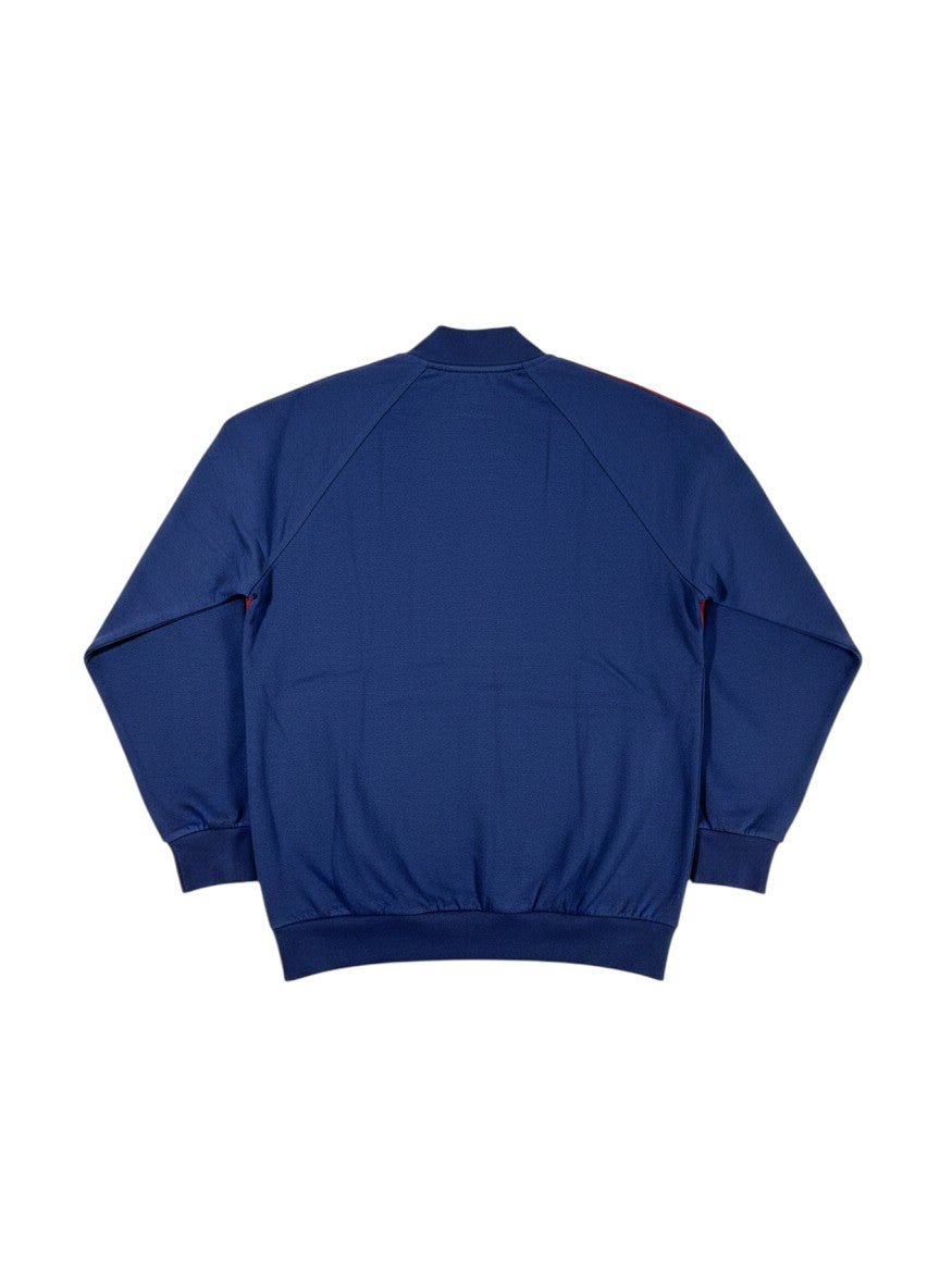 Throwback Rack Levi’s Gold Tab Off Court blue track jacket with red stripe accents on sleeves and collar. Ribbed cuffs and hem.